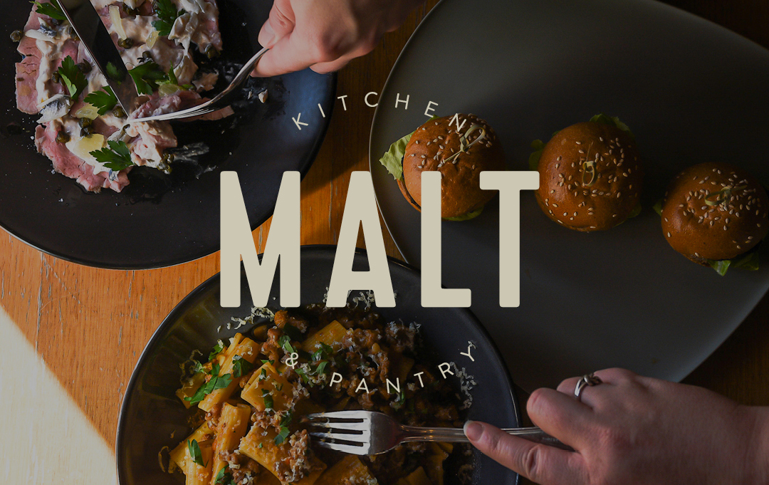 Malt logo layered over birds eye view of plates of food